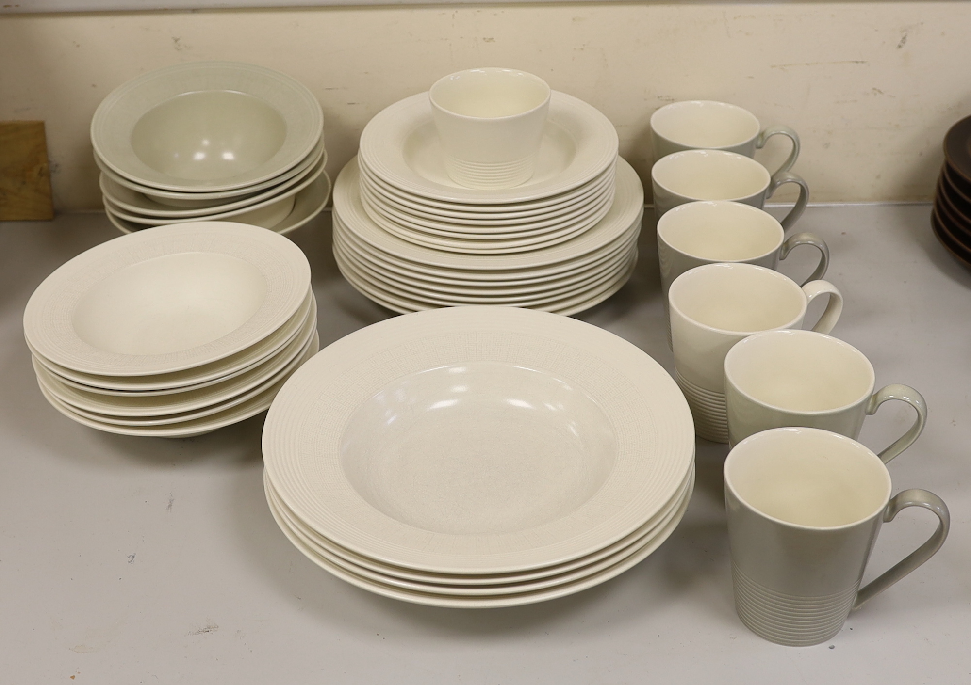 Paul Costelloe for Wedgwood, a part dinner set including six mugs, six bowls and eight dinner plates